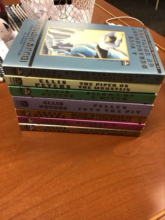 Inspector George False Mystery Series - Set Of 7-A Nice Derangement Of Epitaphs/The Piper On The Mountain/ Flight Of Witch/ Fallen Into The Pit/ Black Is The Color Of My True Love’s Heart/ Rainbow’s End/ The Knocker On Death’s Door by Ellis Peters