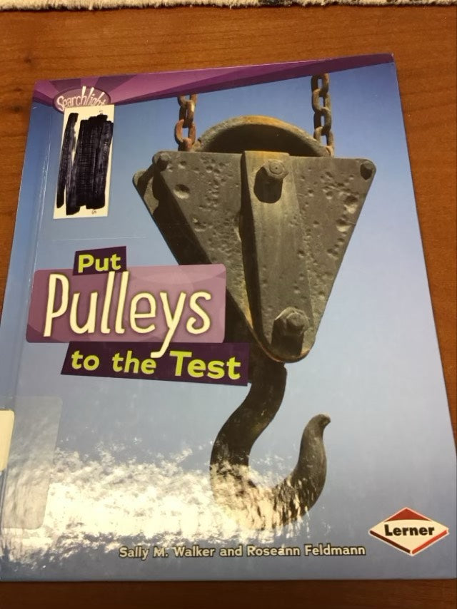 Put Pulleys to the Test (Searchlight Books: How Do Simple Machines Work?) by Sally M Walker * Ex-Library Book